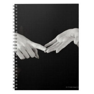 Man signing letter o in British sign language, Notebook