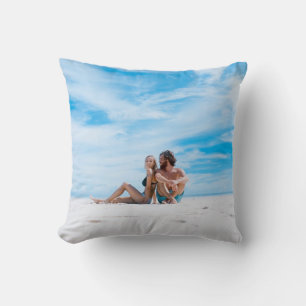 Man sitting beside of woman in black bikini top throw pillow