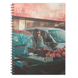 MAN VENDING APPLES NEAR PARKED CARS NOTEBOOK