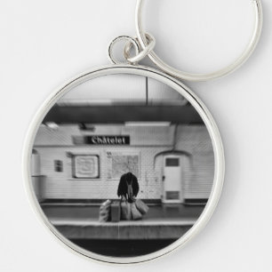 Man with shopping bags in subway (Chatelet) Keychain