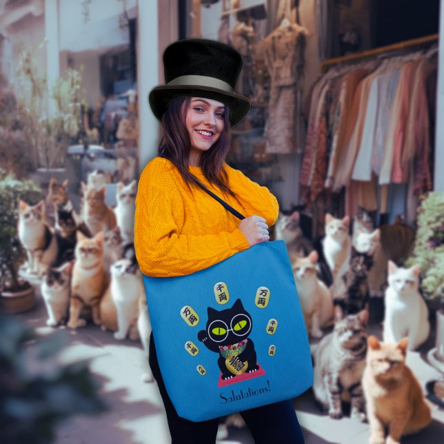Maneki Neko Lucky Poilue Tote Bag (A woman is holding the Maneki Neko Lucky Poilue Tote Bag on the street. )