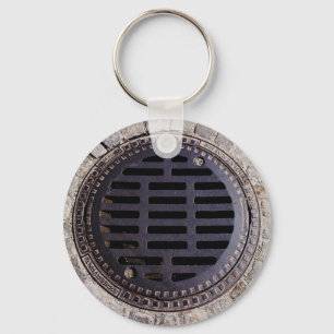 Manhole cover and cobblestone keychain