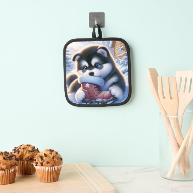 Manique Chiot jouant avec une botte hivernale couverte de  (In situ (suspendu))