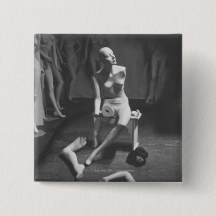 Mannequin with leg and arm removed 2 inch square button