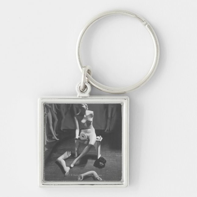 Mannequin with leg and arm removed keychain (Front)