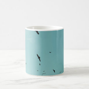 Many birds and a contrail coffee mug