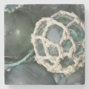 Many glass fishing floats, Alaska Stone Coaster