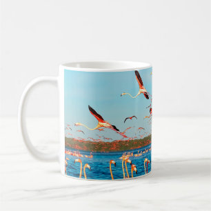 Many pink beautiful flamingos in a beautiful blue coffee mug