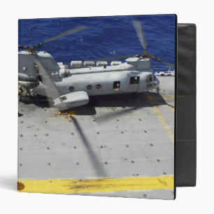 Marines board a CH-46E Sea Knight helicopter Binder