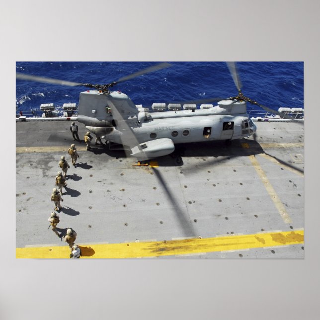 Marines board a CH-46E Sea Knight helicopter Poster (Front)