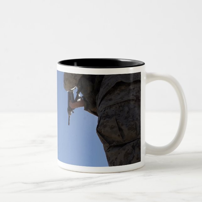 Marines change magazines in the midst of firing Two-Tone coffee mug (Right)