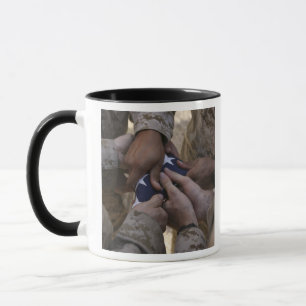 Marines fold an American flag Mug