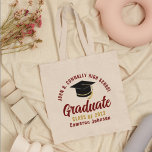Maroon Gold Graduate Personalized 2023 Graduation Tote Bag<br><div class="desc">These modern maroon and gold custom senior graduate tote bag features your high school or college name for the class of 2023. Customize with your graduating year under the chic handwritten script and black grad cap for a great personalized graduation party favour gift.</div>
