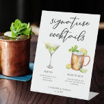 Martini Moscow Mule Signature Cocktails Menu Pedestal Sign<br><div class="desc">This chic signature cocktails pedestal sign features simple black typography above 2 drinks and their ingredients for your wedding bar. A cute Martini and Moscow mule drawing add a cool flair to your bar menu. Complete with the couple's names and date for their reception.</div>