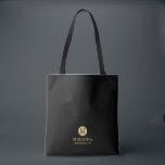 Masculine Black and Gold Personalized Bridesmaid Tote Bag<br><div class="desc">Add a personal touch to your wedding with personalized bridesmaid tote bag. This tote bag features black monogram in gold circle element with name and title in gold professional font style on black background. Also perfect for maid of honour, flower girl and more. Please Note : The foil details are...</div>