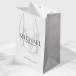Masculine White Personalized Groomsmen Medium Gift Bag<br><div class="desc">Add a personal touch to your wedding with personalized groomsmen gift bag. This gift bag features personalized groomsman's name with title and wedding date in grey and monogram in light grey as background, in classic serif font style, on white background. Also perfect for best man, father of the bride, ring...</div>