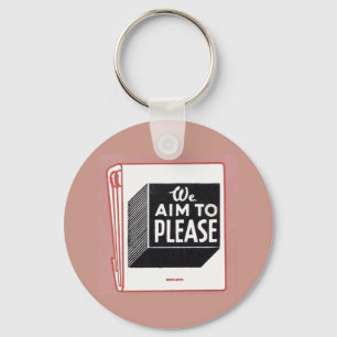 matchbook cover We Aim to Please Keychain