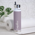 Mauve Personalized Wedding Bridesmaid Colour Water Bottle<br><div class="desc">Gift your wedding bridesmaid or maid of honour with this trendy,  vacuum Insulated water bottle that features her name in white,  stylized script on a mauve colour background designed to match your wedding colour scheme. Personalize bottle by editing and replacing with desired name. Select your water bottle style.</div>