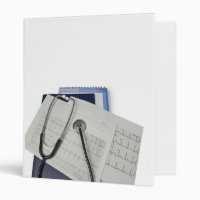 medical stethoscope on cardiogram EKG readings
