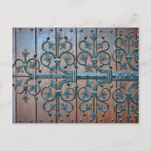 Medieval style wooden gates of basilica postcard