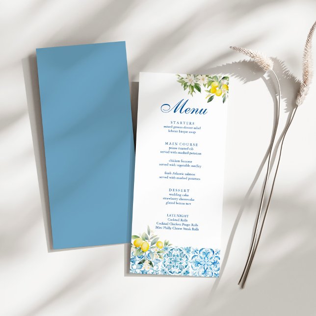 Mediterranean Blue Tiles & Lemon Wedding Menu (Mediterranean Blue Tiles & Lemon Wedding Menu on a sunny white table.)
