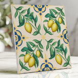 Mediterranean Lemon Citrus Fruit Tile<br><div class="desc">Bring the warmth of the Mediterranean to your home with this vibrant ceramic tile. The design features bright yellow lemons and lush green leaves on a cream background, accented by classic blue and yellow geometric details. This cheerful and sunny pattern is perfect for kitchens, bathrooms, patios, or any space that...</div>