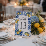 Mediterranean Lemon Wedding Blue Tile Table Number<br><div class="desc">Add a beautiful and cohesive touch to your reception décor with these elegant Amalfi Coast lemon wedding table numbers. Inspired by Mediterranean charm, this design features hand-painted lemons paired with classic blue ceramic tile patterns, creating a fresh and sophisticated Italian coastal look. The layout combines a clean central space with...</div>