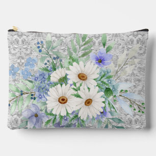 Mélange de marguerites et pochette cosmétique Flor