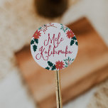 Mele Kalikimaka | Hawaiian Christmas Classic Round Sticker<br><div class="desc">Add tropical cheer to your Christmas season mailings with our island chic stickers. 1.5" stickers feature the Hawaiian Christmas greeting "Mele Kalikimaka" flanked by red poinsettia flowers,  holiday greenery and holly leaves.</div>
