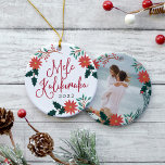 Mele Kalikimaka | Hawaiian Christmas Photo Ceramic Ornament<br><div class="desc">Festive holiday ornament features the Hawaiian Christmas greeting "Mele Kalikimaka" in red hand lettered typography,  surrounded by red poinsettias,  holly leaves and Christmas greenery. Customize with the year,  and add a favourite photo or vacation snapshot to the reverse side,  adorned with matching holiday florals.</div>