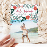 Mele Kalikimaka | Hawaiian Christmas Photo Holiday Card<br><div class="desc">Send holiday greetings to friends and family, island-style, with our tropical holiday photo cards. Design features your favourite photo with the Hawaiian Christmas greeting "Mele Kalikimaka" in red hand lettered typography, flanked by vibrant red poinsettia flowers and holly leaves that cascade over your photo. Personalize with your names and the...</div>