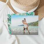 Mele Kalikimaka | Hawaiian Holiday Photo Card<br><div class="desc">Chic full bleed horizontal or landscape-oriented holiday photo card features "Mele Kalikimaka, " the Hawaiian Christmas greeting, in casual white hand lettered script typography as an overlay on your favourite beach or vacation photo. Personalize with your custom holiday message, the year, and your family name beneath. Cards reverse to a...</div>