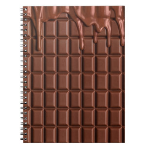 Melted chocolate dripping over a chocolate block notebook