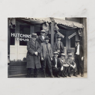 Men In Front of  Hutchings-Davis Drug Store Postcard
