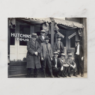 Men In Front of  Hutchings-Davis Drug Store Postcard