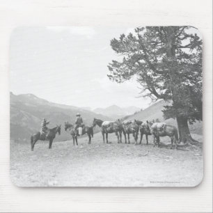 Men with packhorses looking over a hill mouse pad