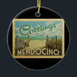 Mendocino Beach Vintage Travel Ceramic Ornament<br><div class="desc">This Greetings From Mendocino vintage postcard design features a sandy beach with a beautiful turquoise ocean water and above the sea,  a blue sky with billowy white clouds. In vintage travels style.</div>