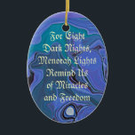 menorah lights blue ornament<br><div class="desc">Blue swirls of night colour flow in the background. A text message: "For eight dark nights,  menorah lights remind us of miracles and freedom." on one side. On the other a silver and blue menorah.</div>