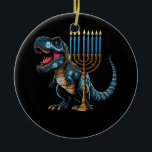 Menorasaurus Rex Trex Dinosaur Hanukkah Menorah Je Ceramic Ornament<br><div class="desc">Fun cute dino who love history and dinosaurs! Makes a great tee for anyone who loves dinosaurs, t rex, stegosaurus, triceratops, brontosaurus, tyrannosaurus rex! What a great tee for girls who loves dinosaurs! Dinosaur Dino tee, Dinosaur lover. Hanukkah is a Jewish festival commemorating the rededication of the Second Temple It...</div>