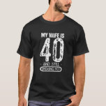 Mens 40th Birthday T Shirt - My Wife Is 40 And Sti<br><div class="desc">Get one of these low pricing T-shirts now! The prices can rise up any time. Also have a look at our other Shirts by clicking on the Brand name above! Looking for a birthday present for your awesome wife? Looking for a birthday present for your awesome wife? This funny, vintage...</div>