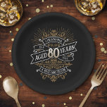 Mens Funny Whiskey 80th Birthday Paper Plate<br><div class="desc">Celebrate the big 8-0 with style and humour with this vintage whiskey label-inspired birthday design. The black, gold, and white typography is ornate and elegant, giving it a classic retro vintage feel. Perfect for man (or woman!) in your life who loves their scotch, spirits, bourbon, and other liquor drinks. Features...</div>