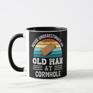 Mens Never underestimate an Old Man at Cornhole Mug
