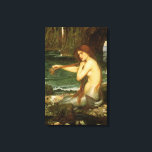 Mermaid by John William Waterhouse Canvas Print<br><div class="desc">A Mermaid (1901) by JW Waterhouse is a vintage Victorian Era Pre-Raphaelite fine art portrait painting. A mermaid is brushing her hair on the beach by the seashore. A mermaid is a mythological aquatic creature that is half human and half fish. About the artist: John William Waterhouse (1849-1917) was an...</div>