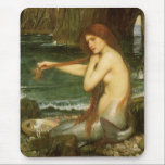 Mermaid by John William Waterhouse Mouse Pad<br><div class="desc">A Mermaid (1901) by JW Waterhouse is a vintage Victorian Era Pre-Raphaelite fine art portrait painting. A mermaid is brushing her hair on the beach by the seashore. A mermaid is a mythological aquatic creature that is half human and half fish. About the artist: John William Waterhouse (1849-1917) was an...</div>