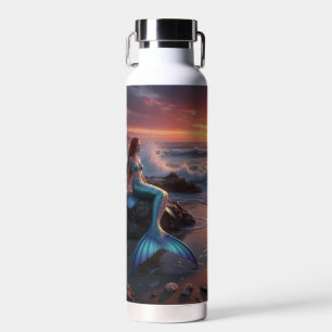 Mermaid by the sea in the sunrise water bottle
