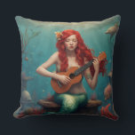 Mermaid playing the ukulele throw pillow<br><div class="desc">A picture of a red-haired mermaid playing the ukulele to creatures under the sea</div>