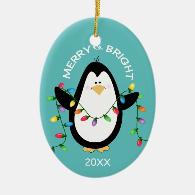 Merry and Bright Christmas Penguin Fun Blue Oval Ceramic Ornament (Front)