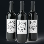 Merry And Bright Christmas Script Calligraphy Wine Label<br><div class="desc">A beautiful modern trendy script typography Christmas holiday wine label gift. Simply personalize with your family name and add this label to your bottle of wine that you are gifting or serving during the holidays. Unique and cheerful style for the holiday season to lift spirits and bring a smile to...</div>