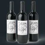 Merry And Bright Christmas Script Calligraphy Wine Label<br><div class="desc">A beautiful modern trendy script typography Christmas holiday wine label gift. Simply personalize with your family name and add this label to your bottle of wine that you are gifting or serving during the holidays. Unique and cheerful style for the holiday season to lift spirits and bring a smile to...</div>