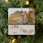 Merry and Bright Custom Family Photo Christmas Ceramic Ornament<br><div class="desc">Celebrate the festive season with our Merry and Bright Custom Family Photo Christmas Ceramic Ornament. This ornament captures the warmth and joy of Christmas with a simple yet modern design that features warm, contemporary colours. Perfect for adding a personalized touch to your holiday decor, it allows you to showcase a...</div>